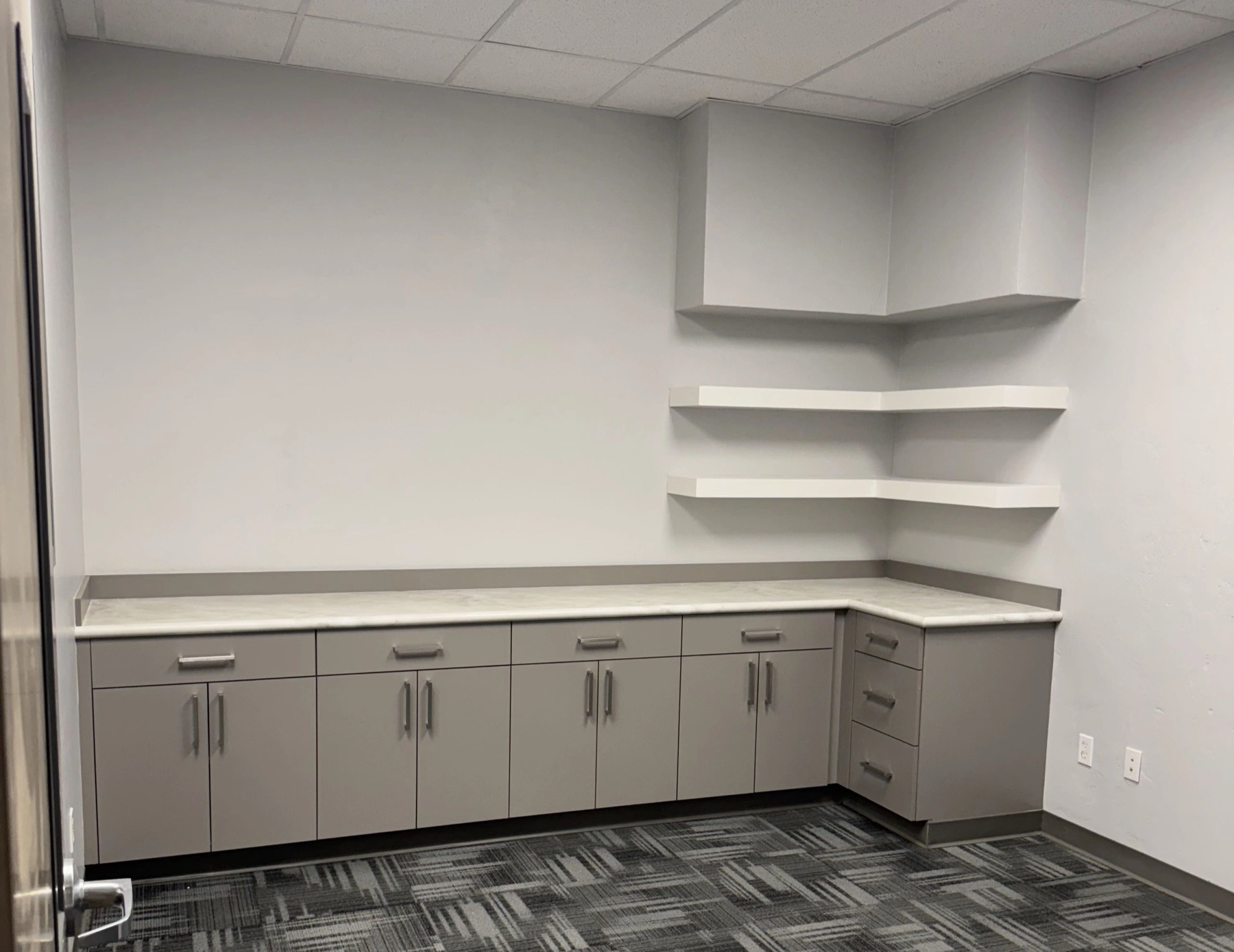 Commercial cabinetry corner with floating shelves