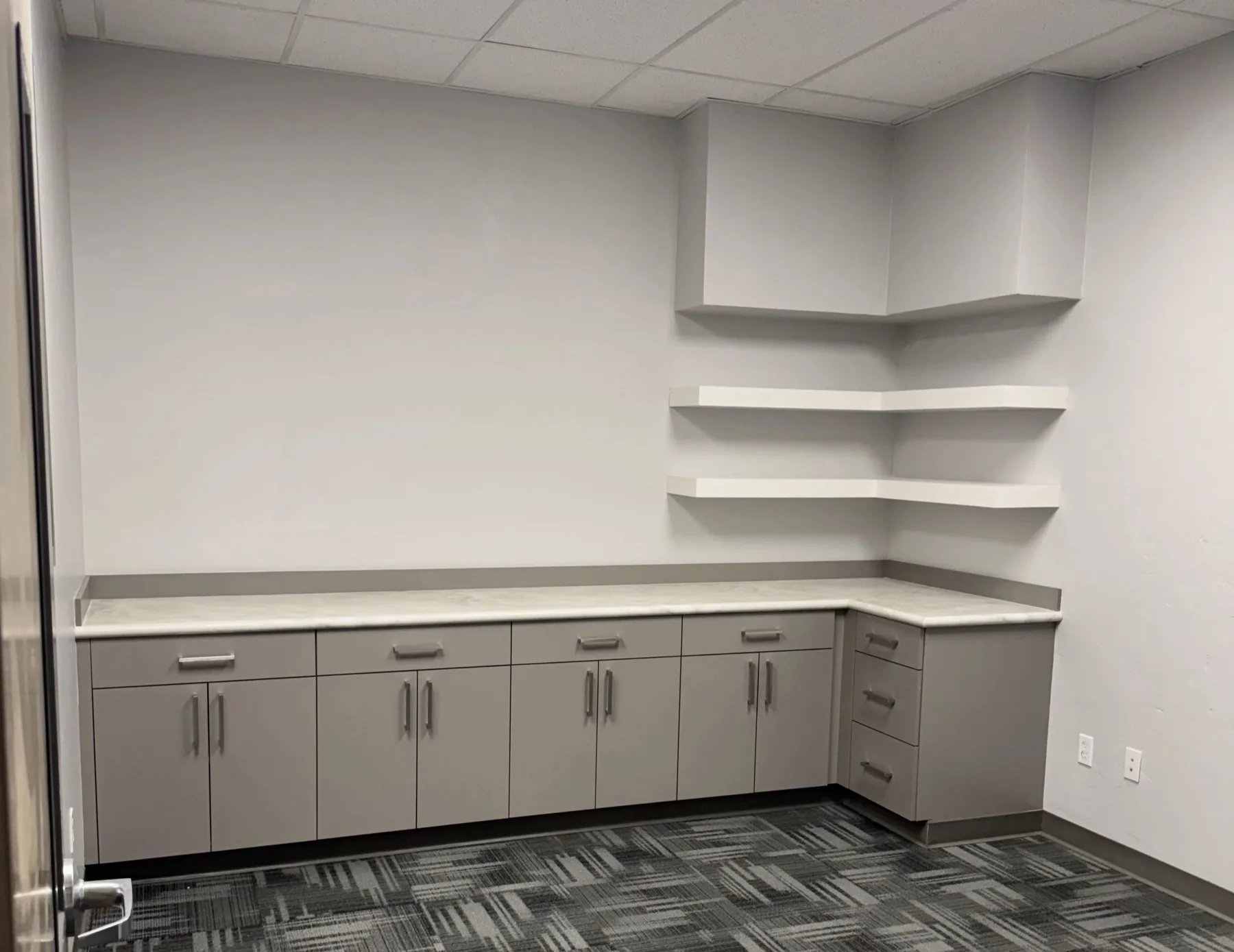 Commercial cabinetry corner with floating shelves